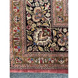 Finely knotted Persian Qom silk rug, overall pink ground with ivory field, the field with central cusped medallion profusely decorated with interlacing foliate and stylised flower heads, multiple band boarder, the main band decorated with a series of stylised motifs and trailing foliage, the outer guard with signature panel 
