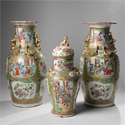 Cantonese famille rose vases, of inverted baluster form, the domed cover with gilt dog of ...