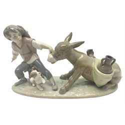 Lladro figure, Boy Pulling Donkey, modelled as a boy with a stubborn donkey, sculpted by Juan Huerta, with original box, no 5178, year issued 1982, year retired 1993, H12cm