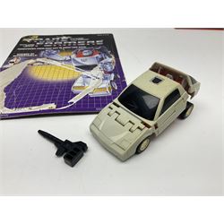 Four 1980sTransformer G1 - Optimus Prime 1984; DinoBot Sludge (Diplodocus) 1984; Cyclonus 1986; and Runamuck 1986; with paperwork; seven Bandai Robo Machines Robots/Transformers; almost fully stocked Panini Sticker album; two annuals; three comics; two posters; and Ladybird story book