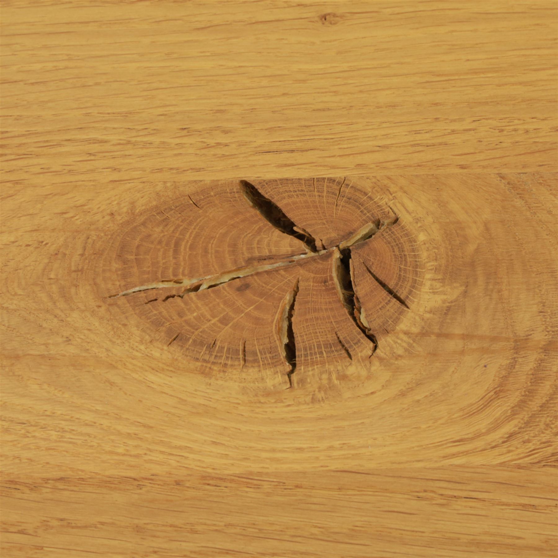 Contemporary light oak dining table, painted tripod bases with stretcher 