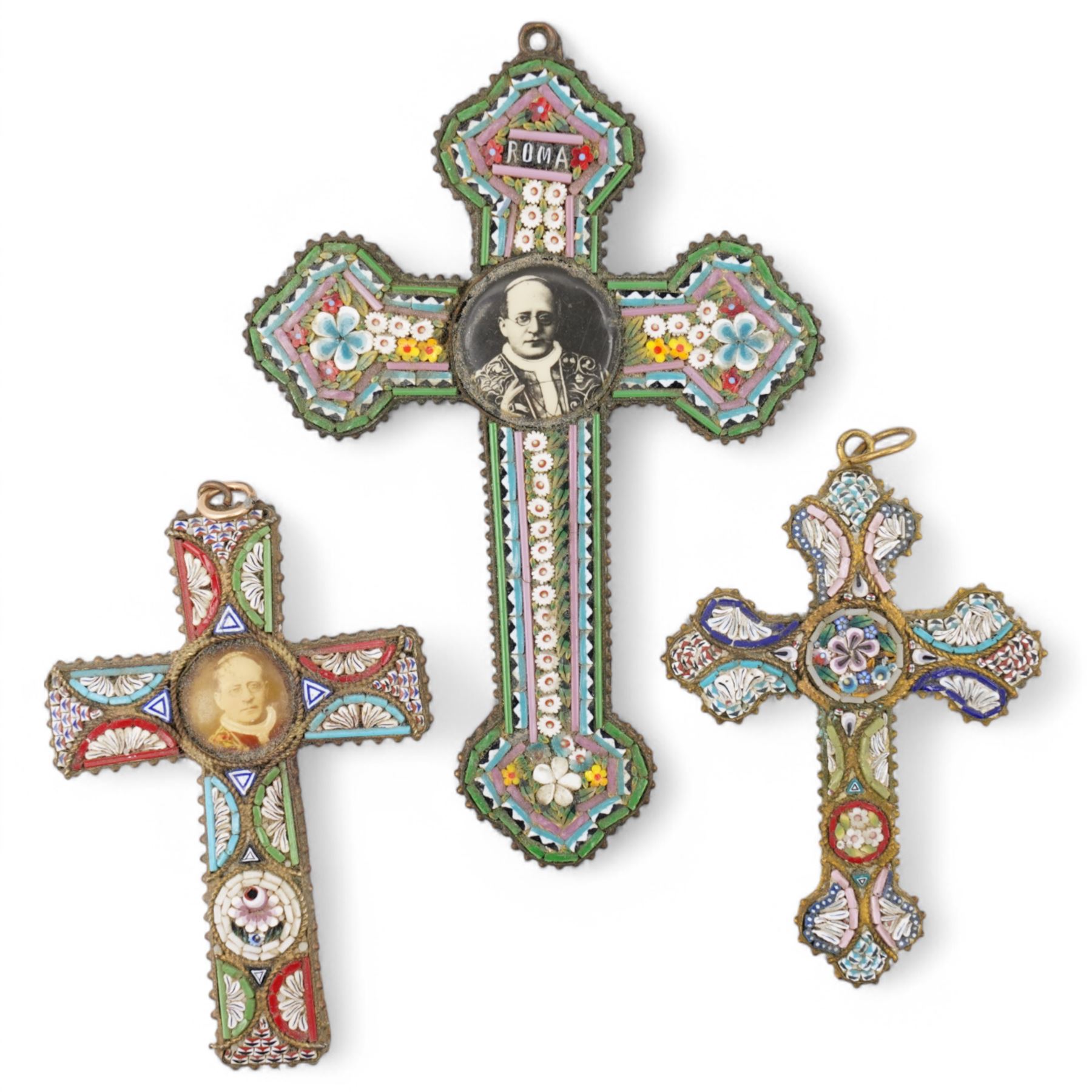 Set of six Italian micro mosaic cross pendants, each decorated with repeating floral patterns, two with central panels depicting Pope Pius XI, largest H10cm