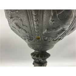Victorian cast spelter oil lamp, decorated with cherubs and foliate scrolls, supporting a glass reservoir, burner and clear glass chimney, H62cm