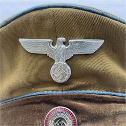 WW2 German Political Leaders brown cloth visor cap with metal insignia; labelled K. Hartel Weiden