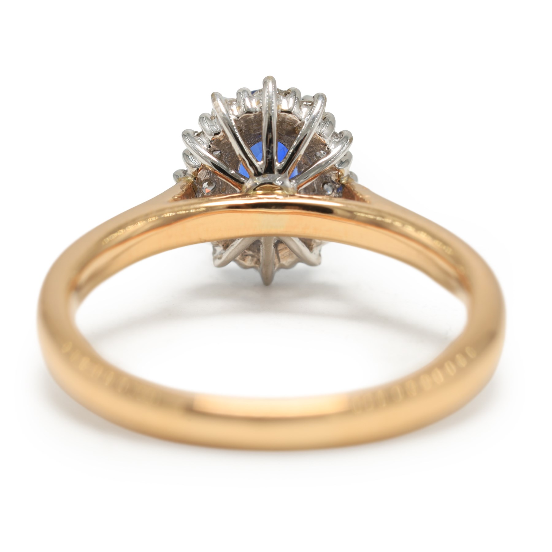 18ct rose gold sapphire and diamond cluster ring, single oval cut sapphire of approx 1.25 carat, with round brilliant cut diamond surround, hallmarked, total diamond weight approx 0.25 carat