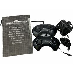 1990s Sega Megadrive 16bit games console with five games comprising Sonic the Hedgehog, Fifa International Soccer, Mickey Mouse Castle of Illusion, MicroMachines 2 Turbo Tournament and 1994 Lillehammer Winter Olympics, boxed with instructions