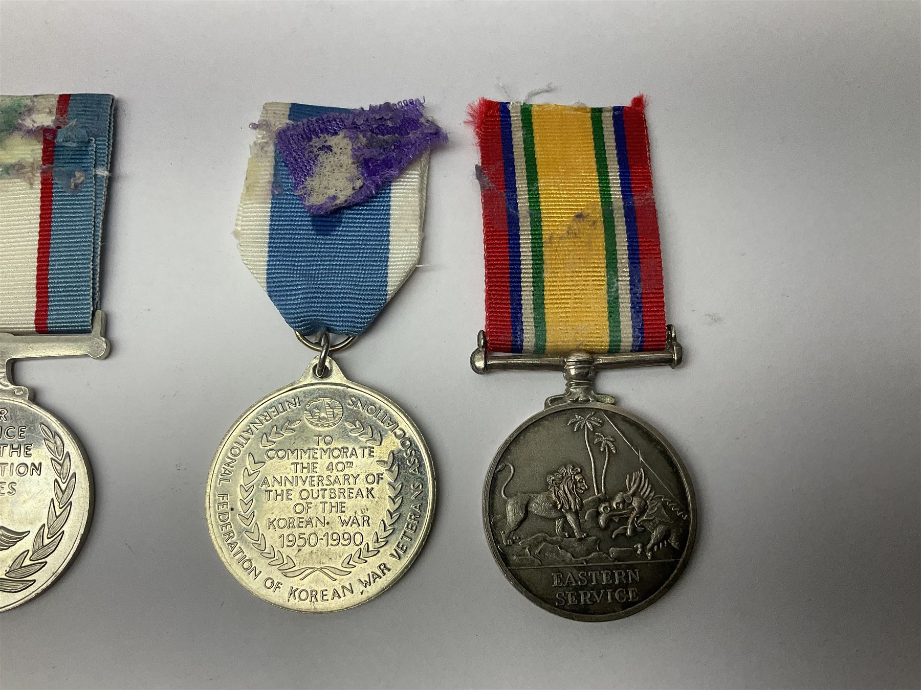 1949 Yangtze Incident HMS Consort casualty Naval General Service Medal with two clasps for Yangtze 1949 and Malaya awarded to D/SSX. 788562 J. Tootell A.B.R.N.; with four other medals comprising Republic of Korea War Service Medal, Eastern Service Medal, unofficial British and Commonwealth Occupation Forces Association Occupation of Japan medal and IFKVWA 40th Anniversary Medal; together with an archive of contemporary and later related items including Certificate of Service 1946-54, Recommendations for Advancement and Conduct Record Sheet 1946-53, Quartermasters History Sheet 1949-53, Destroyer Association China Station 1945-53 beret, later manuscript journal with his own account of the Yangtze incident etc, Joe's birth certificate details dated 1968, reprinted half-length portrait in uniform, Manual of Seamanship 1937, modern shield and framed crests, blazer badges and metal badges and a copy of Loyal & Steadfast - The Story of HMS Consort 2008, which gives details of how Joe Tootell received his wounds, the extract reads ' When Consort came under fire a short time later it was a strange, perhaps unreal experience for many of the crew who had never seen action before. Ordinary Seaman Joe Tootell was in the wheelhouse. 'I could not see the action. We could hear the ship taking severe punishment. When the wheelhouse took a direct hit, killing the coxwain, Chief Petty Officer Gurney, and myself receiving multiple shrapnel wounds, the steering mechanism was put out of action.'