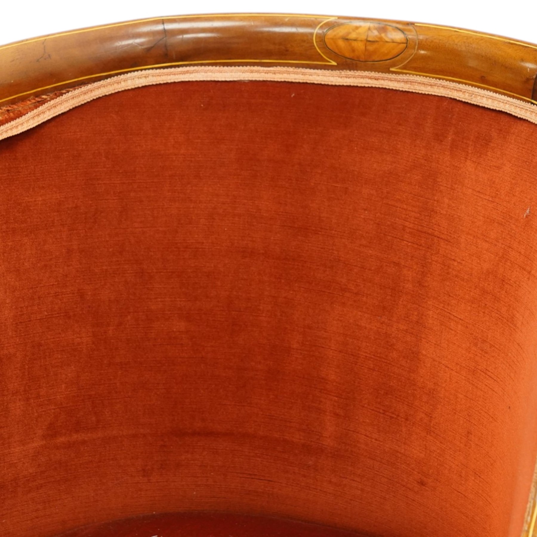 Pair of Edwardian inlaid mahogany tub armchairs, traditional shape with satinwood stringing, upholstered in crimson fabric with sprung seat, on square tapering supports with castors