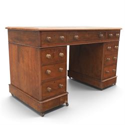Victorian mahogany twin pedestal desk, rectangular top with red tooled leather writing surface with three frieze drawers, each pedestal with three drawers and castors
