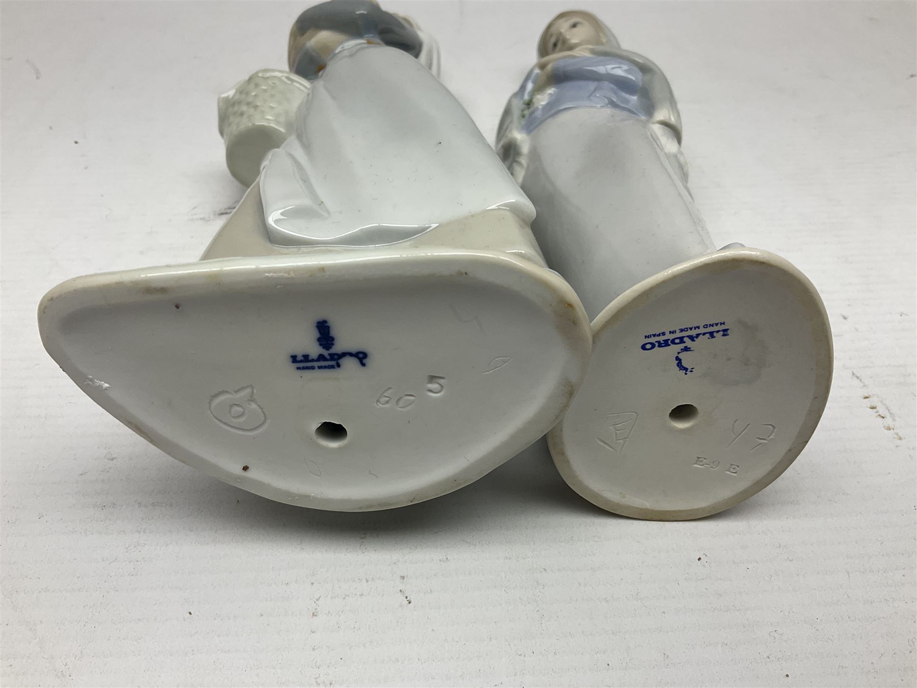 Four Lladro figures, including Girl With Cockerel no 4591, Gres Lonely no 2076 etc together with Nao figure 