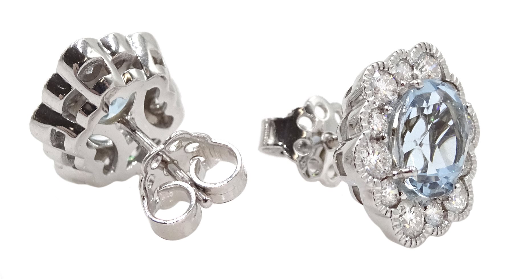Pair of 18ct white gold oval aquamarine and diamond cluster stud earrings, hallmarked, total aquamarine weight approx 2.50 carat, total diamond weight approx 0.75 carat