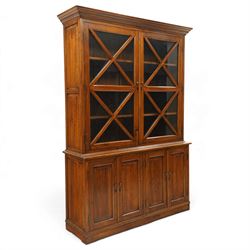 OKA - Glazed bookcase dark oark cabinet, the top with projecting cornice above astragal style glazed doors metal turned knobs, enclosing adjustable full length shelving, the lower half with two sets of twin cabinet doors housing fixed shelving, raised on a moulded plinth base  