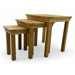 Contemporary light oak nest of three tables, each with rectangular top with moulded edge, ...