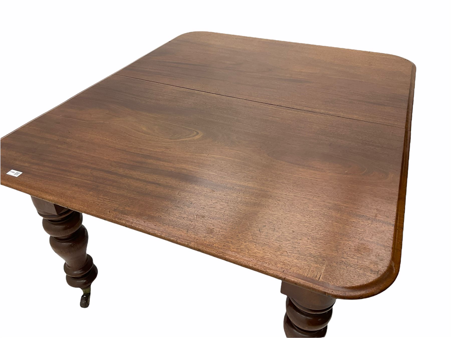 Victorian mahogany extending dining table, with leaf