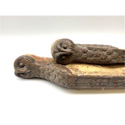 A pair of 20th century carved walnut chair legs/supports, carved with owl masks, fruiting and acanthus detail, and paw feet, H58cm. 