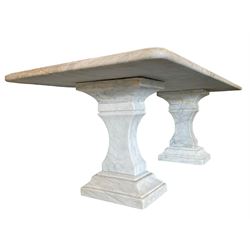 Classical Grecian design Carrera marble centre table, the rectangular single slab top with rounded corners and carved edge, raised on twin pedestals comprised of three pieces with a waisted column on a stepped plinth