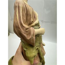 Pair of Royal Dux figures, no. 1115, modelled as a shepherd with a goat by his side and a shepherdess feeding a lamb, each wearing flowing green and pink robes with gilt detailing, with pink triangle mark beneath, H51cm