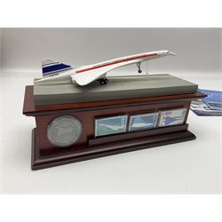 Danbury Mint 'The Ultimate James Bond Collection' comprising stamps and coins housed in a display case, 'Concorde Queen of the Skies' sculpture, stamps, medallion display and 2020 'Centenary of the Unknown Warrior' five pound coin cover in Harrington and Byrne folder