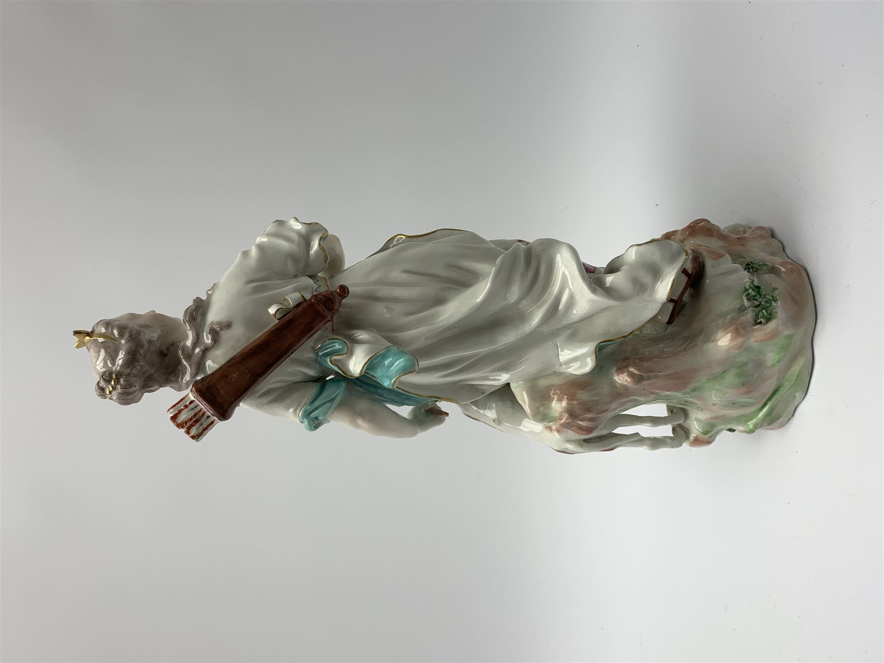 Mid 18th century Derby porcelain figure modelled as Dianna the Huntress, with quiver of arrows upon her back and dog by her side, upon a naturalistically modelled base, with patch marks beneath and collectors labels, H26cm