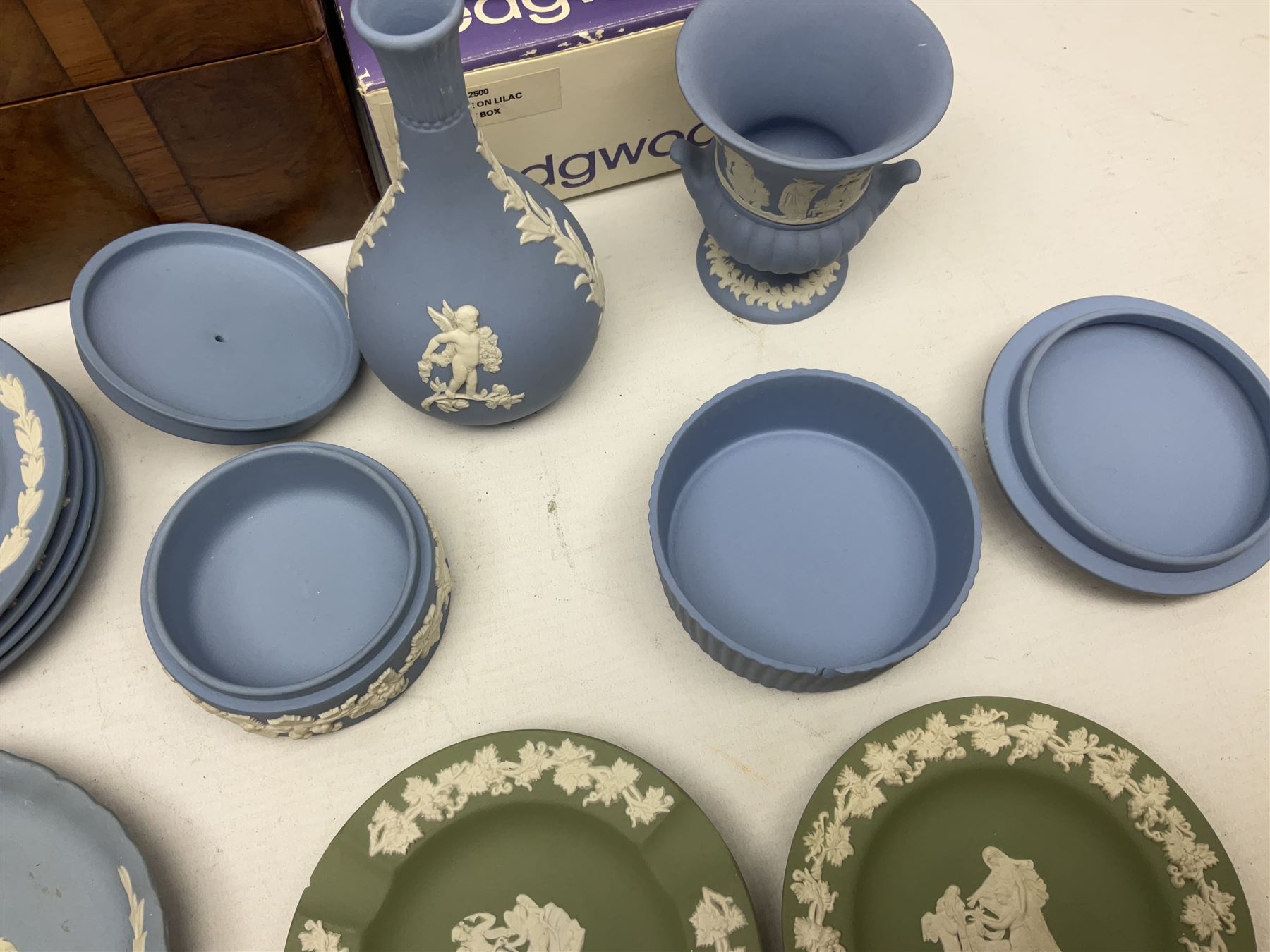 Wedgwood Jasperware to include lilac trinket box with original box, light blue vases, trinket dishes, boxes etc, together with a walnut box, coins and other collectables 