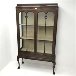 Early 20th century mahogany display cabinet, two glazed doors enclosing lined interior above two drawers, cabriole legs on ball and claw feet, W106cm, H176cm, D36cm