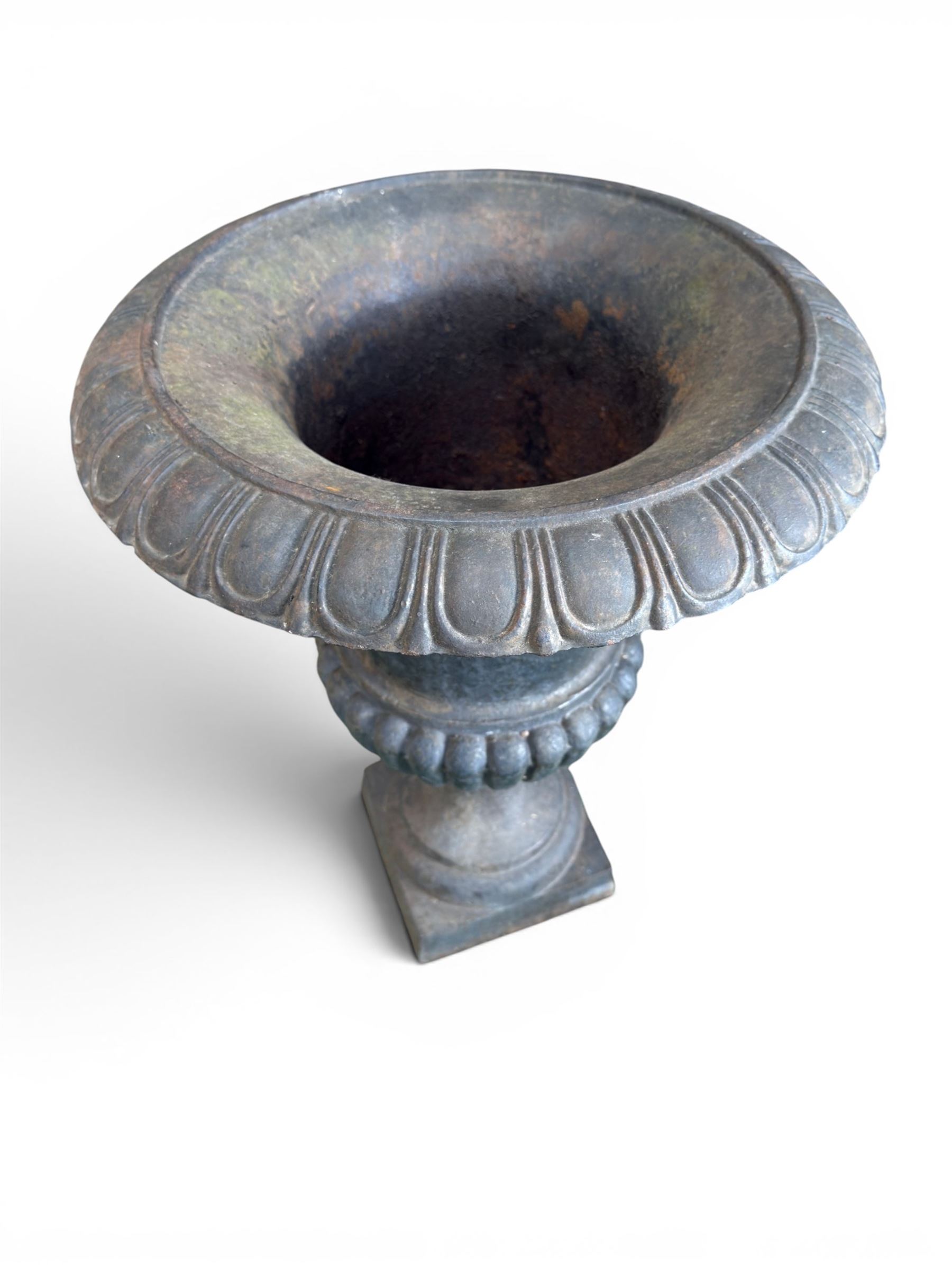 Pair of Victorian design heavy cast iron garden urns, black painted, egg and dart rim on waisted column