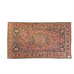 Persian Sarouk rug, richly decorated with an elaborate central medallion of palmettes and ...