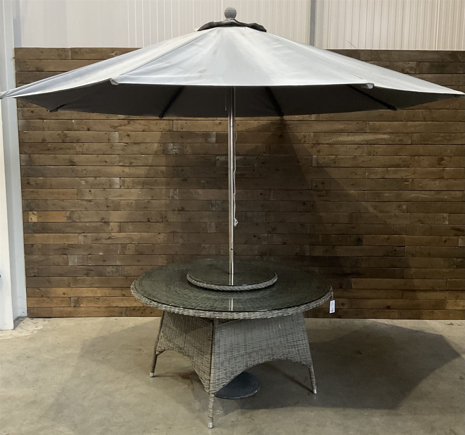 LeisureGrow circular rattan garden table, with lazy Susan, five armchairs with cushions, parasol and weighted base, with glass tops