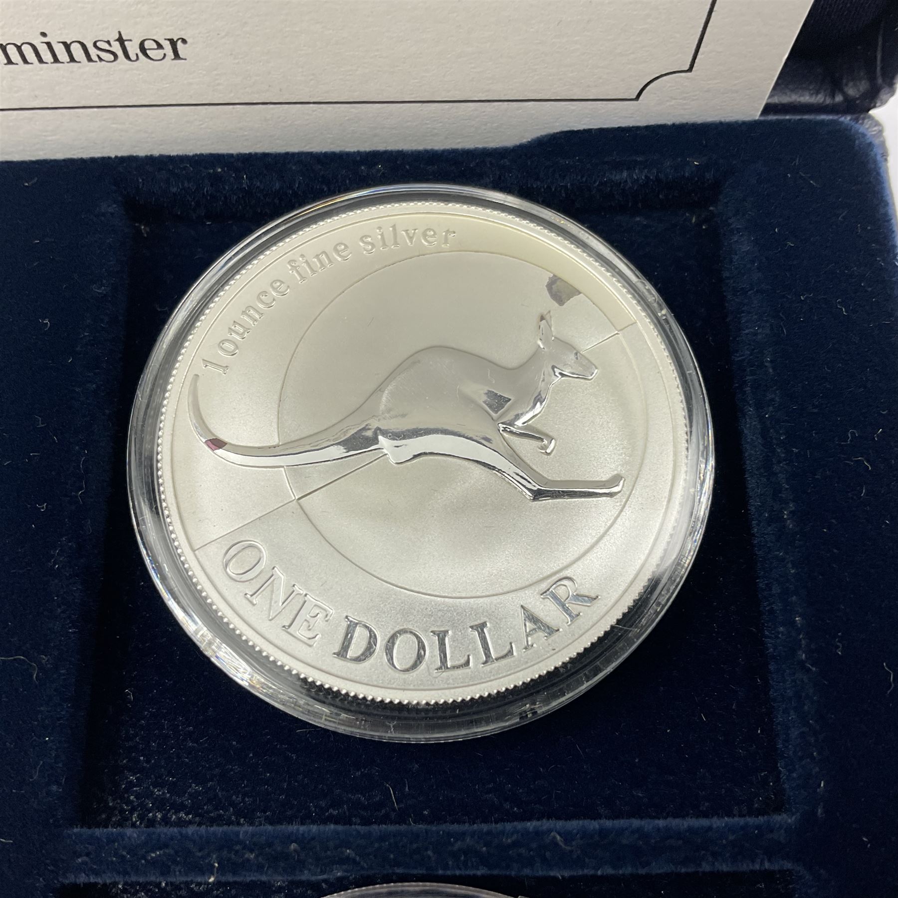 Four one ounce fine silver coins, forming 'The 2004 Famous World Silver Coin Collection', comprising United States eagle, Australian kangaroo, Chinese panda and Canadian maple leaf, cased with Westminster certificate 