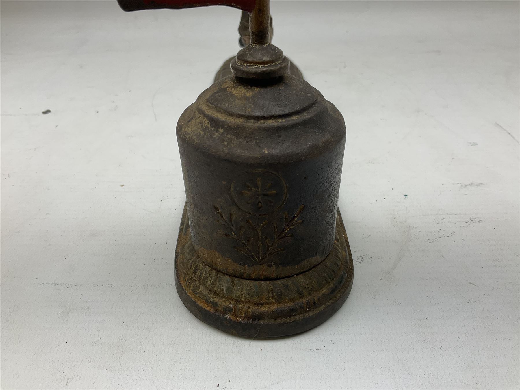Very rare 19th century John Harper & Co. mechanical cast-iron money box, registered number 33821 patented 1885, inscribed on metal plaque 'Wimbledon Bank', based on the Queen's Trophy for shooting at Wimbledon, depicting a British Infantry man in red tunic and blue trousers lying on the ground using a gun to fire a brass coin launcher into a pill box with fixed flag above L30cm