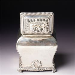 Edwardian silver tea caddy of bombe outline with shell moulded finial, shell moulded and gadrooned base on scroll feet H15cm London 1902 Maker Thomas Bradbury & Sons