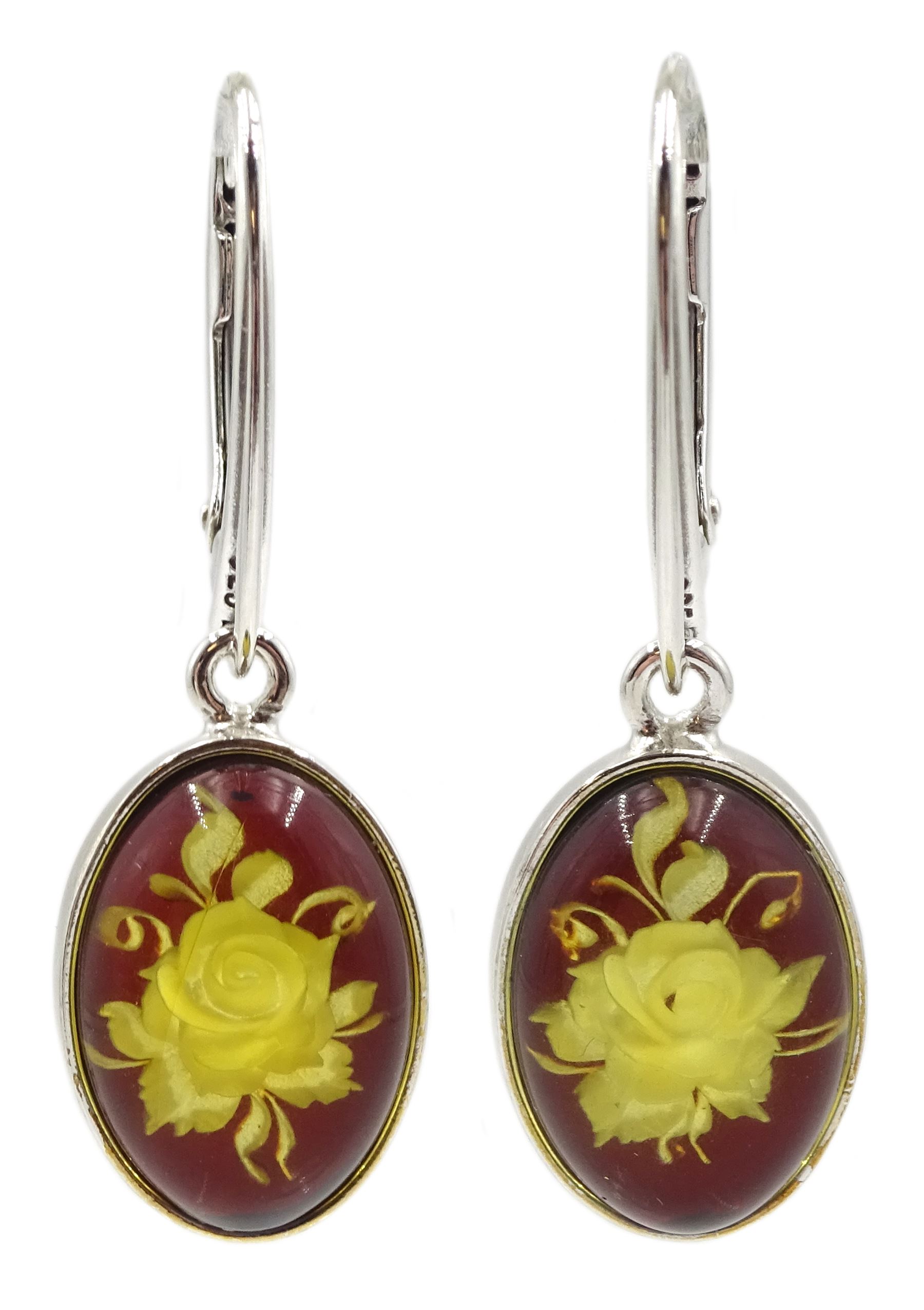 Pair of silver oval amber engraved rose pendant earrings, stamped 925 