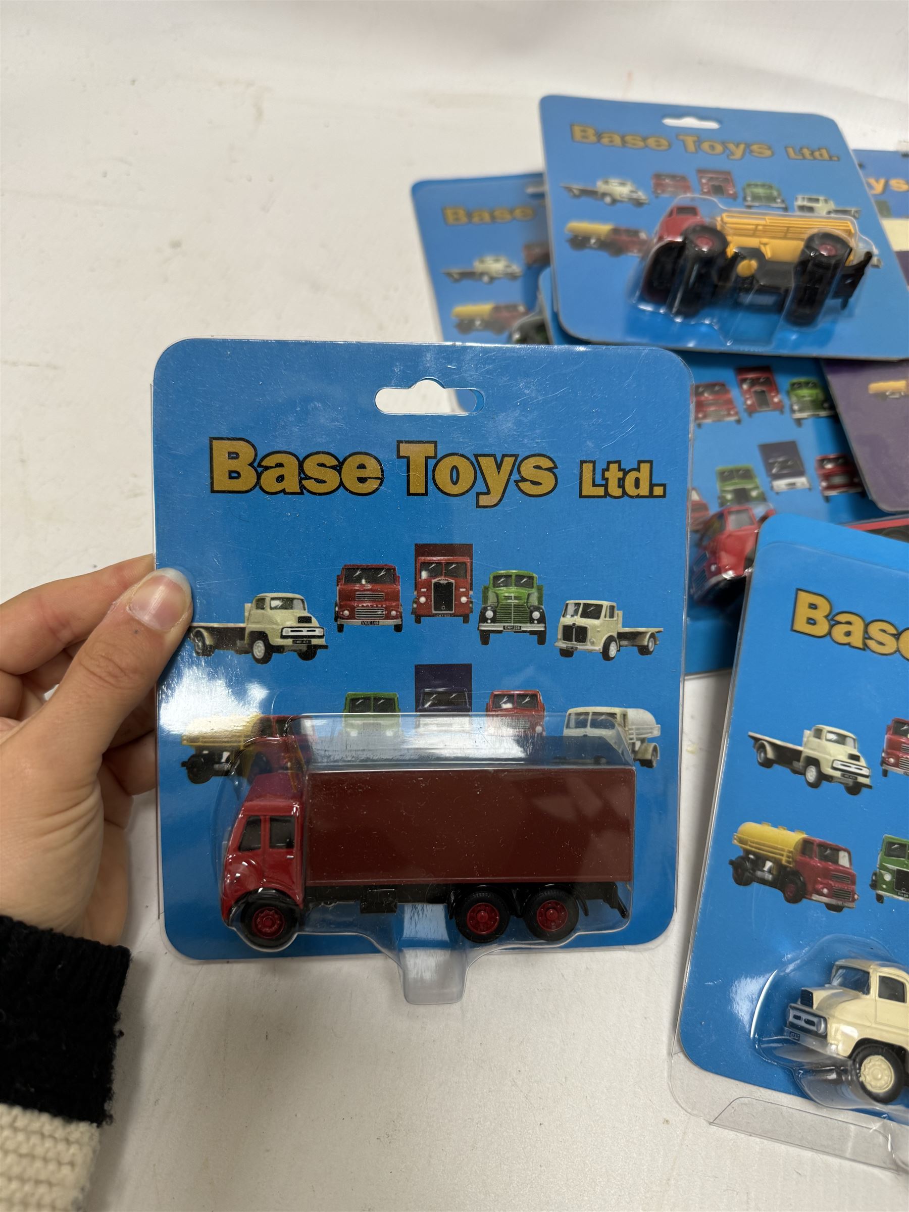 Twenty one Base Toys 1:76 scale diecast vehicles, all in original blister packs