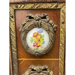 French walnut framed classical wall mirror, circular brass cherub panel, Limoges type porcelain roundels, bevelled plate