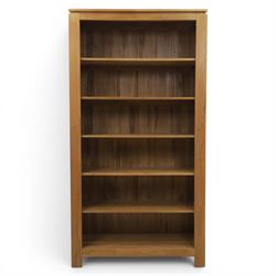 Solid light oak open bookcase, fitted with six open shelves