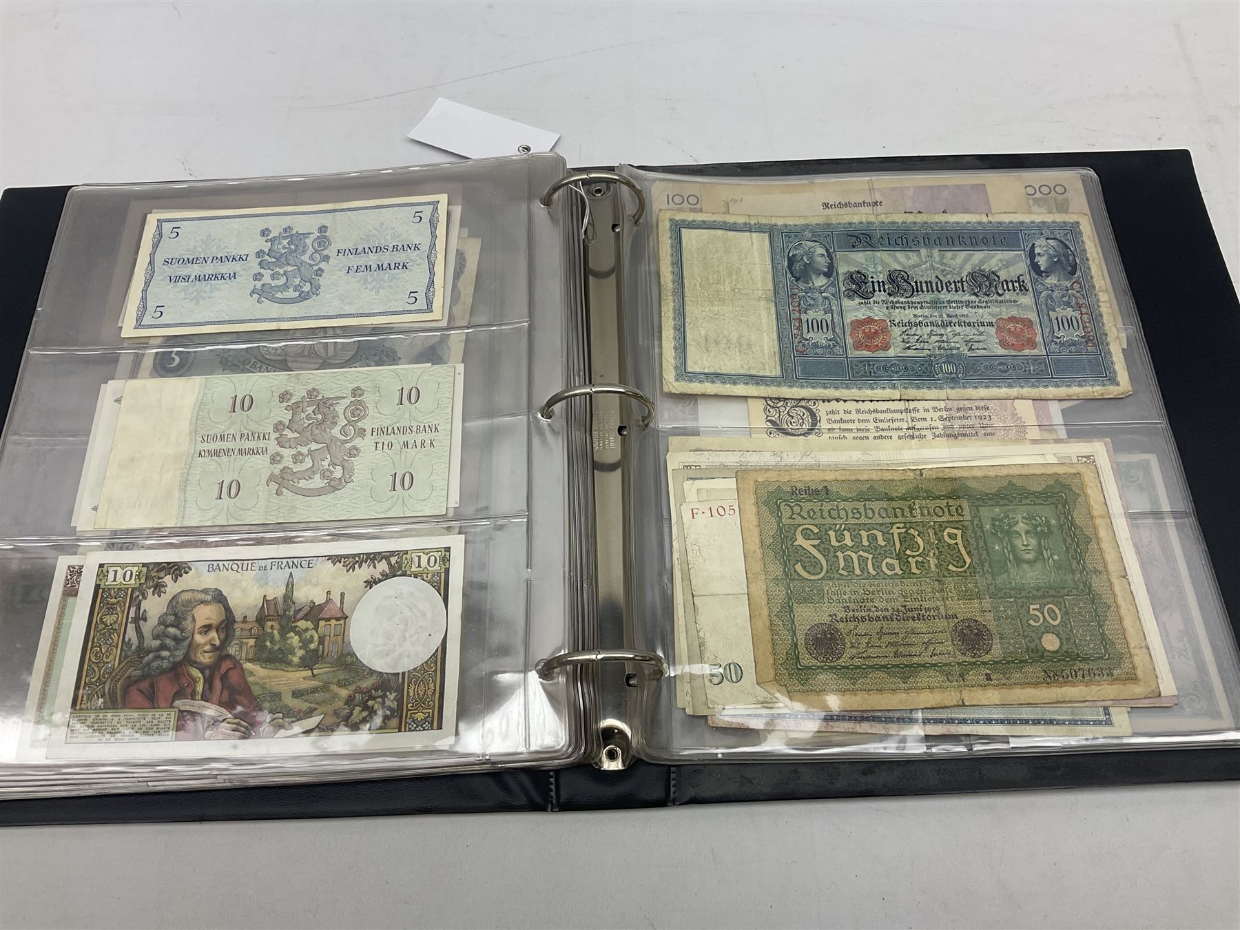 World banknotes, including Queen Elizabeth II The States of Jersey one pound 'DB202703', five pounds 'BB527762' and ten pounds 'AB651481', reserve bank of New Zealand two dollars '1L3 741894', King George V Straits Settlements one dollar 1st January 1935 'F/83 28924', various Bank of England notes etc, housed in two ring binder albums