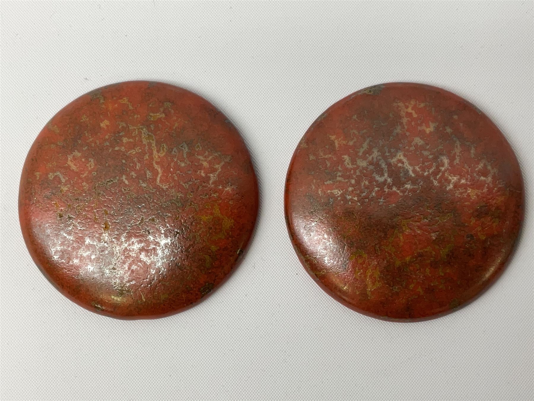 Henry George Murphy (1884-1939), collection of seven Arts & Crafts glazed ceramic roundels, of circular and oval form, five in tones of red and brown and two in tones of blue, turquoise and green in soufflé and high fired finishes, largest example D6.5cm