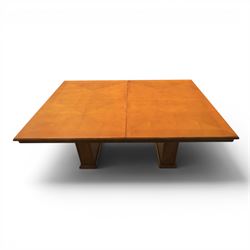 Modern Art Deco design walnut extending dining table, rectangular top with rounded moulded edge, geometric parquetry veneered panels, extending action with additional leaf extending to 220cm, on twin panelled pedestal supports with stepped plinth feet