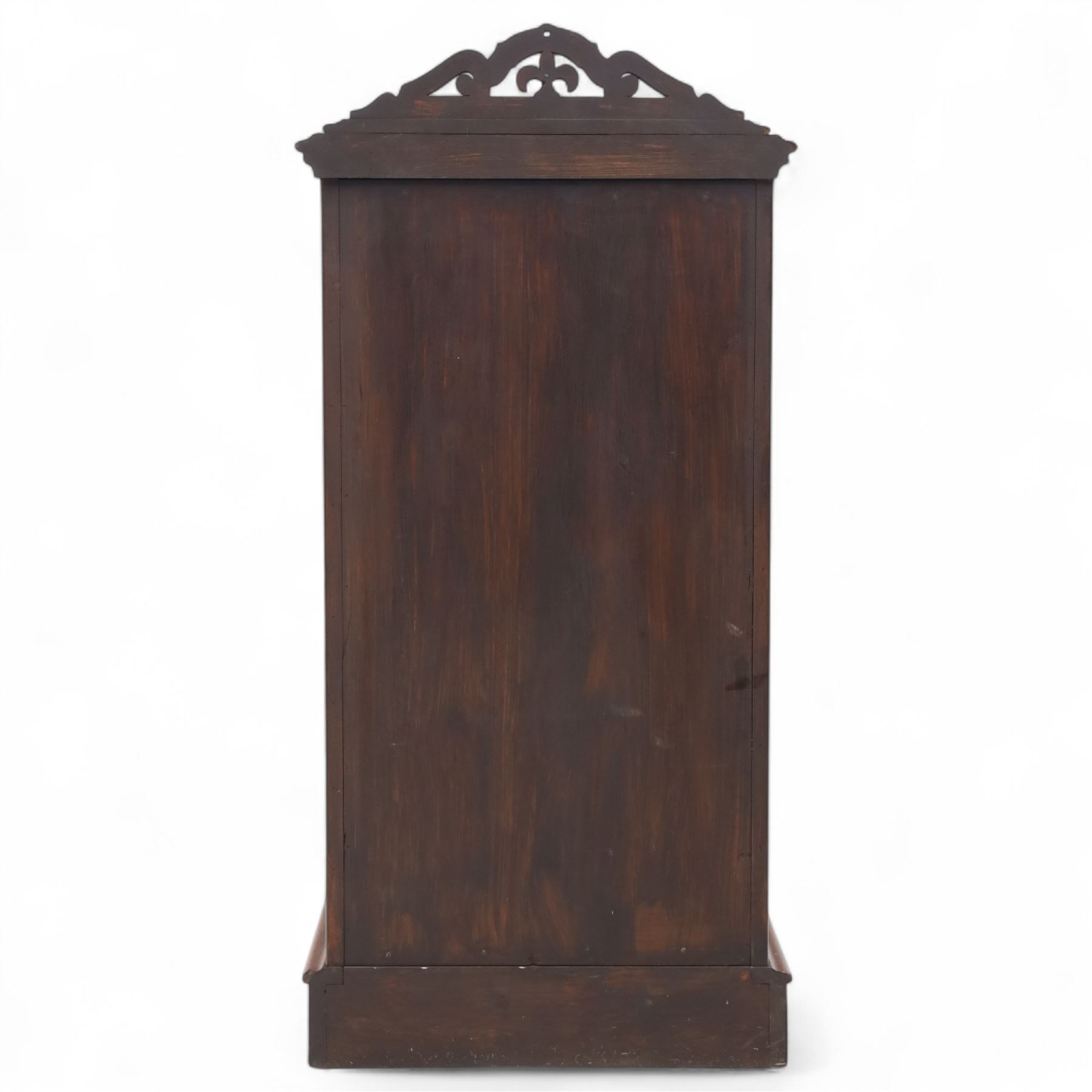Pair of tall Victorian mahogany bedside chests, of narrow upright form, rectangular top with moulded edge, the back with raised pierced fretwork gallery, above four graduated drawers with knob handles, raised on a plinth base 