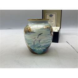 Limited edition Moorcroft enamel vase, decorated in the Lundy Island pattern, with certificate signed by the artists, no 58/75, in fitted box