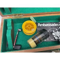 Four Abu fishing reels, comprising Ambassadeur 9000, Ambassadeur 7000, Ambassadeur 5500 and Ambassadeur 6500, together with additional line, hardy fishing bag and two wooden boxes