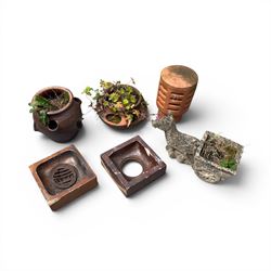 Collection of garden platers including two strawberry pots, cast stone planter, chimney top and two terracotta drain surrounds