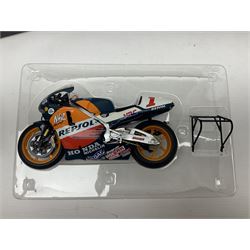 Three Ixo Models 1:12 scale die-cast models of motorcycles - BRB007 Honda NSR500 Michael Doohan 1998; BRB001 Honda RC211V Valentino Rossi 2003; and Yamaha YZR-M1 Colin Edwards MotoGP Phillip Island 2007; all boxed (3)