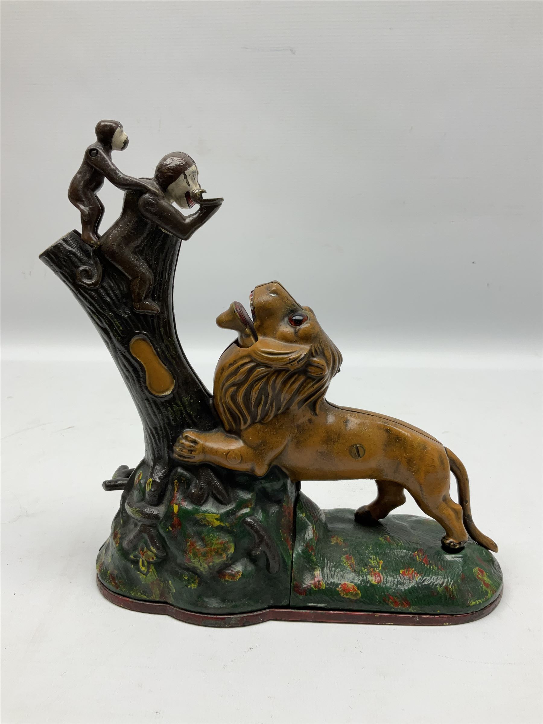 Late 19th century cast-iron mechanical money bank 'Lion and Two Monkeys' by Kyser & Rex with impressed patent mark for 17th July 1883 H25cm L23.5cm