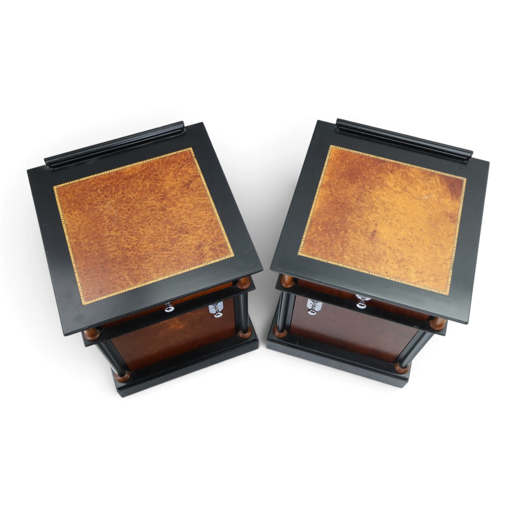 Pair of Art Deco design burr walnut and ebonised bedside cabinets, rectangular inset tops with raised rear galleries, each fitted with a drawer above a cupboard, flanked by cylindrical columns, on plinth bases