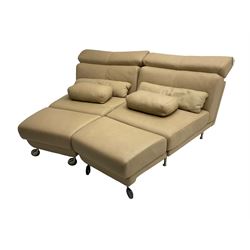 Natuzzi - Italian modular two seat sofa, the two triangular sections with adjustable head rests and interconnected swing end foot stools, upholstered in beige leather, with matching loose cushions