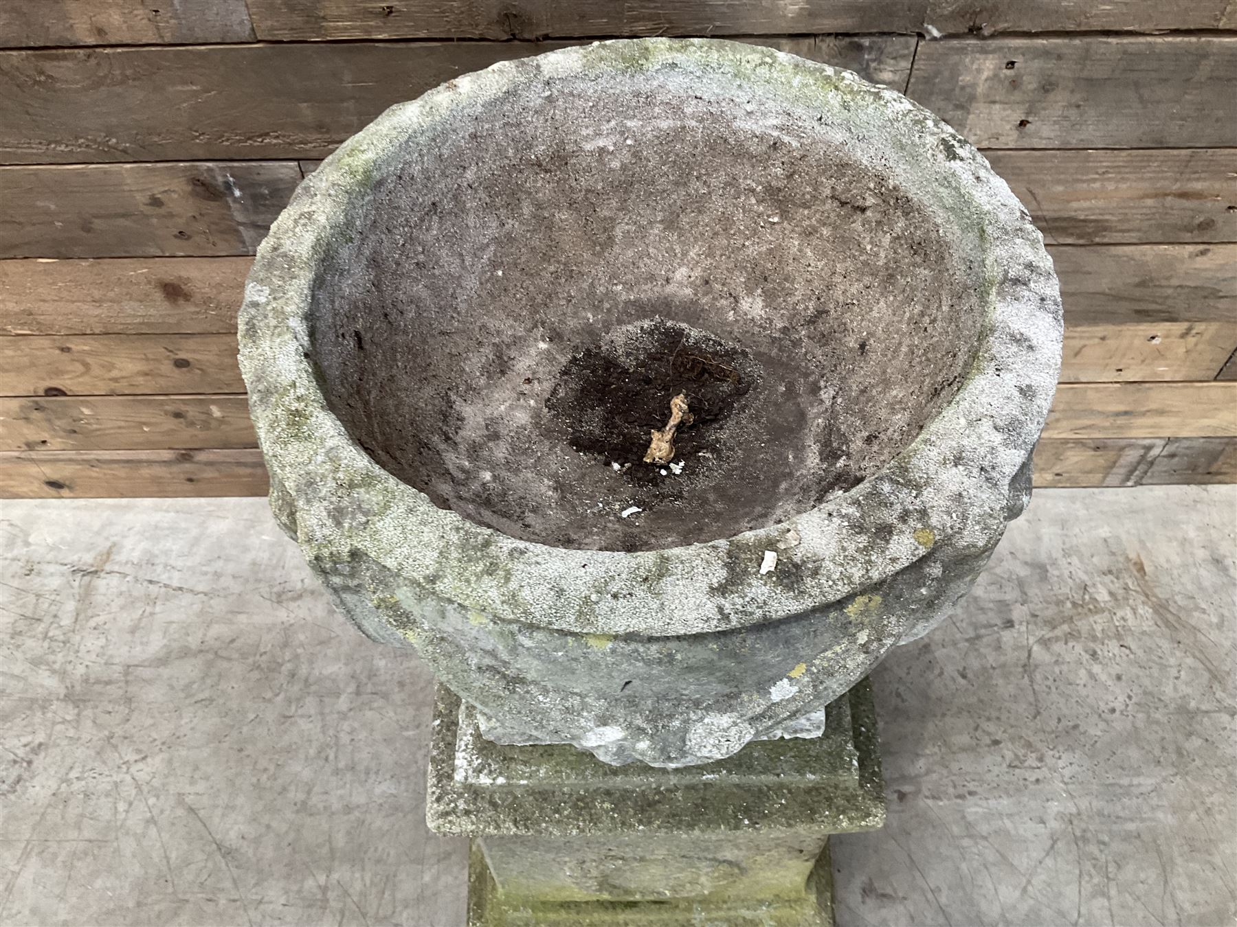 Cast stone centerpiece urn on plinth