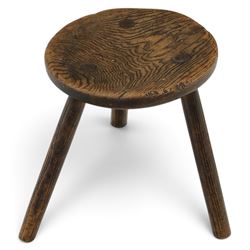 18th century ash and elm milking stool, circular figured top raised on cylindrical supports