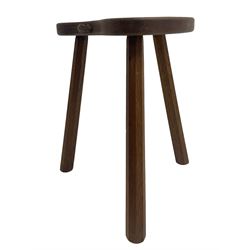 'Mouseman' oak three-legged stool, kidney shaped dished seat carved with mouse signature to edge, by Robert Thomas of Kilburn