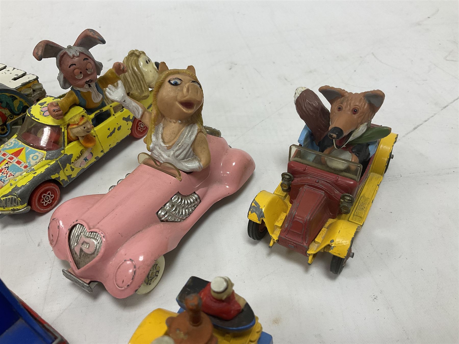 Corgi - ten unboxed and playworn TV/Film related die-cast models including three Popeye Paddle Wagons; Dick Dastardly; Magic Roundabout; Muppets; Batman Penguinmobile; and Basil Brush (10)